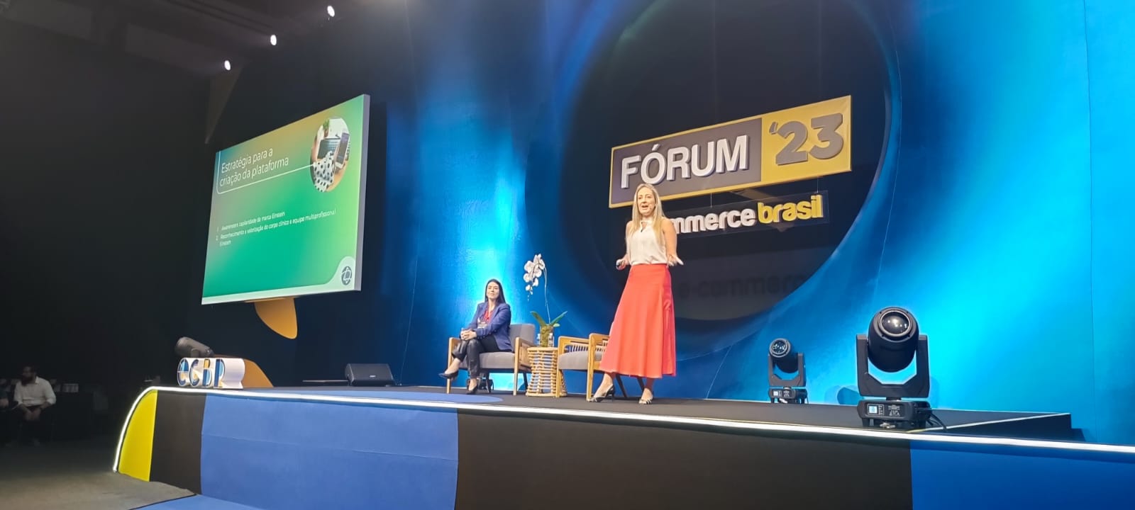 Image of two speakers on stage at the event